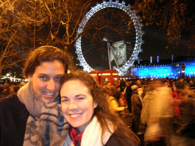 Tara and Emily awaiting Big Ben to strike midnight in London, with the London Eye behind them.