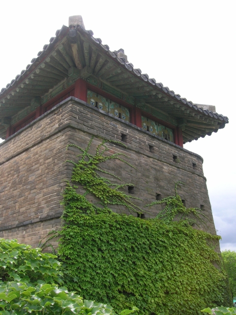 The lookout tower along the wall of an old fortress wall in South Korea.